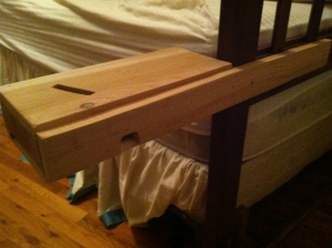 Glued and nailed a board to the back that is then secured to the rear side of the head board for the bed.